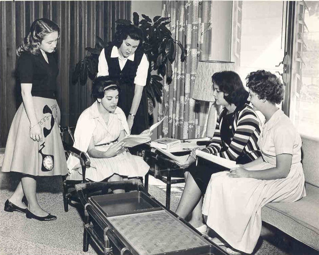 Students talking in a residence hall room